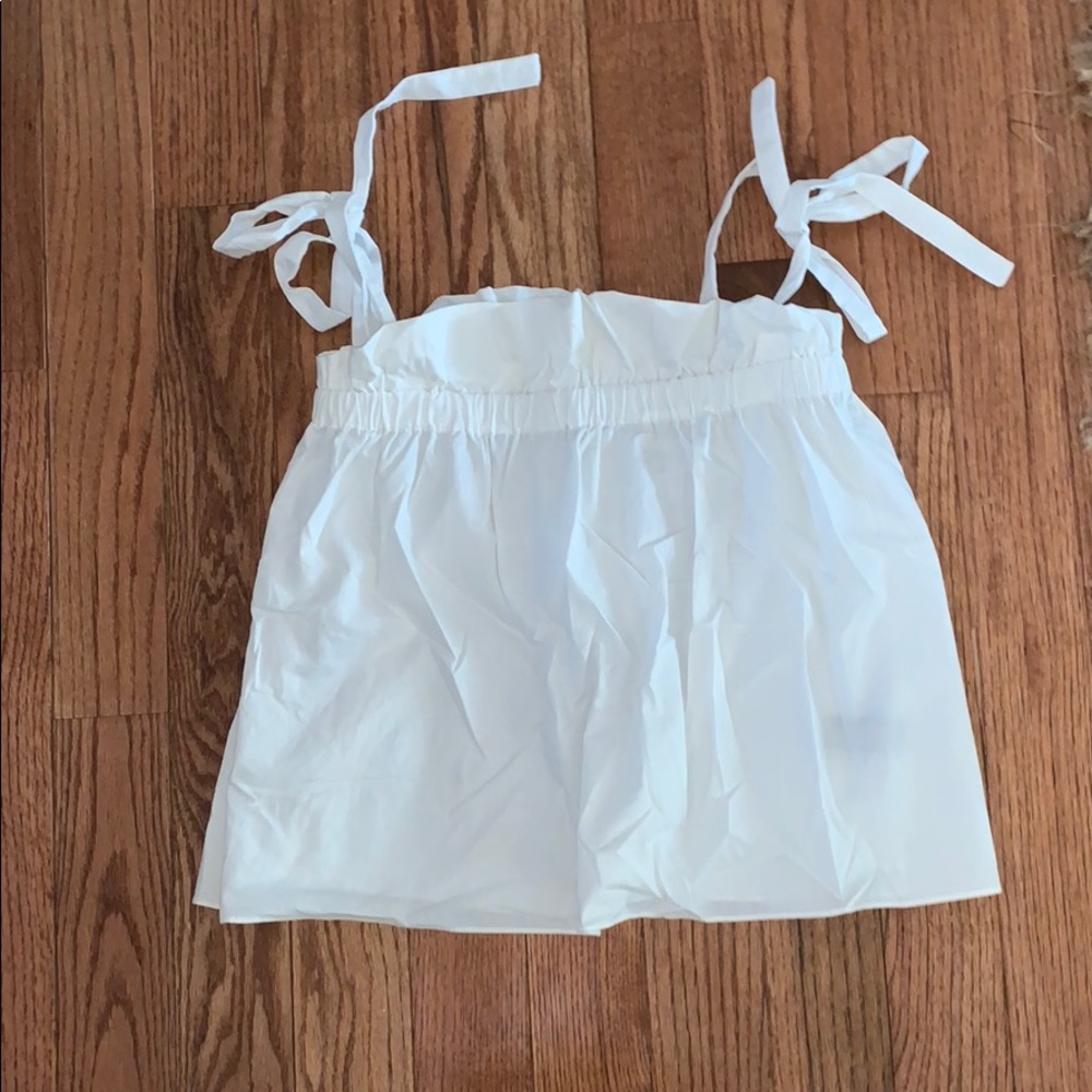 white top with ties on shoulders